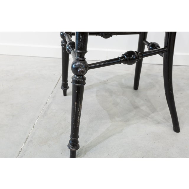 Set of four chairs made of bent beech wood. Decorated with scrolls and palmettes on the backrest.