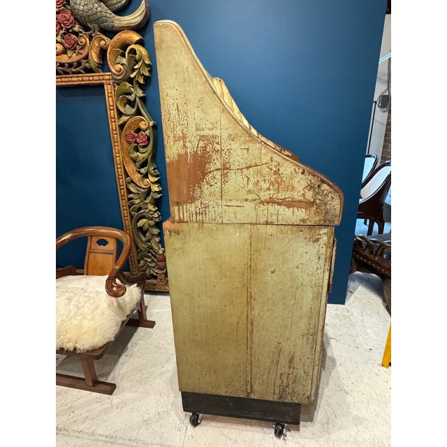 A striking antique general store clerk’s desk, rich in history and layered with decades of authentic wear. Crafted from...