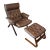 A Beautiful Vintage Danish Norwegian Attributed to Ekornes “Uno” Lounge Chair With Stool in a Brown Leather, Circa 1970s. For Sale