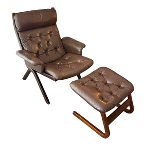 A Beautiful Vintage Danish Norwegian Attributed to Ekornes “Uno” Lounge Chair With Stool in a Brown Leather, Circa 1970s.