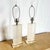 This striking pair of Art Deco lucite table lamps brings sculptural elegance to any space. Each lamp features a tall...