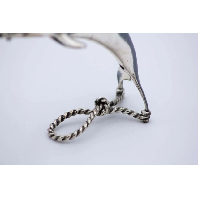Dolphin in Nickel Silver with Corded Support, in Very Good conditions. Designed 1980 to 1989 This piece has an attribution...
