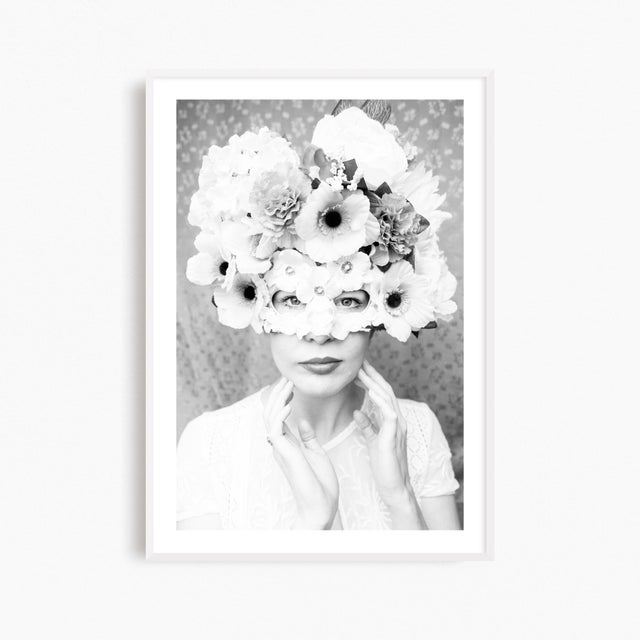 This large contemporary photograph features a mysterious woman adorned in a botanical masquerade mask. A striking black...
