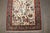 A persian rug from the 1930s depicting a pictorial bird design on an ivory ground