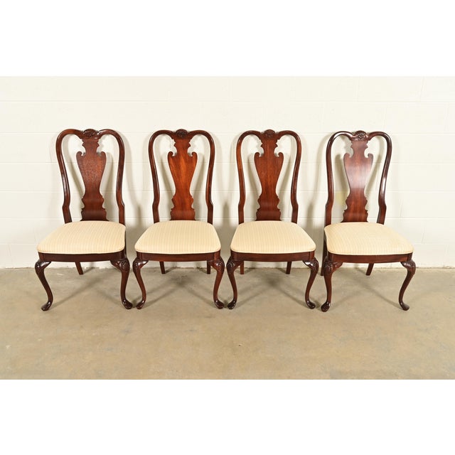 A gorgeous set of four Queen Anne or Georgian style dining chairs By Thomasville USA, Circa 1980s Solid carved mahogany...