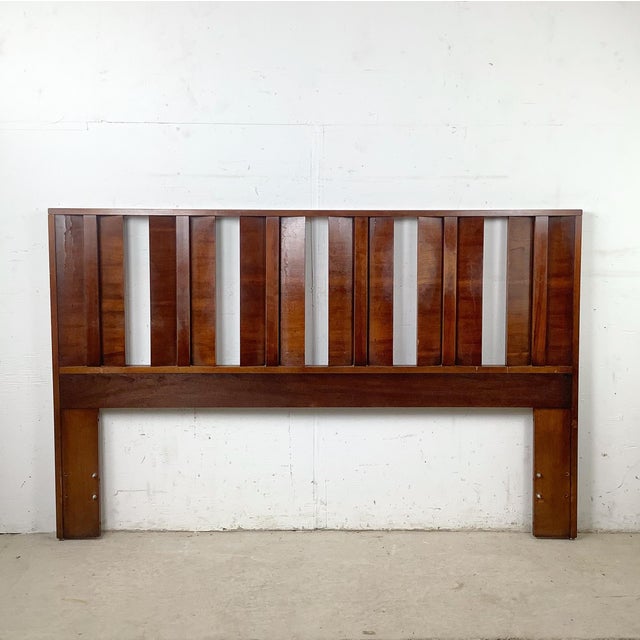 This vintage Mid-Century Modern queen headboard exemplifies the clean architectural lines and understated sophistication...