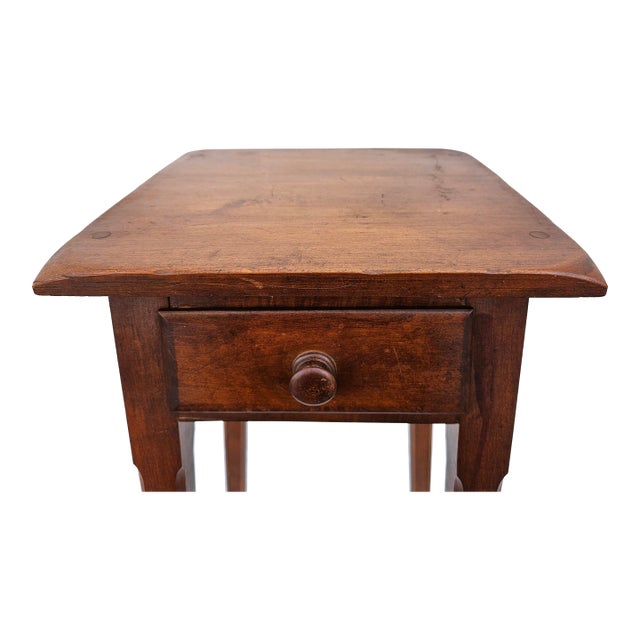 This primitive Federal style one drawer side table could be used as a tall nightstand. The top has rounded or downturned...