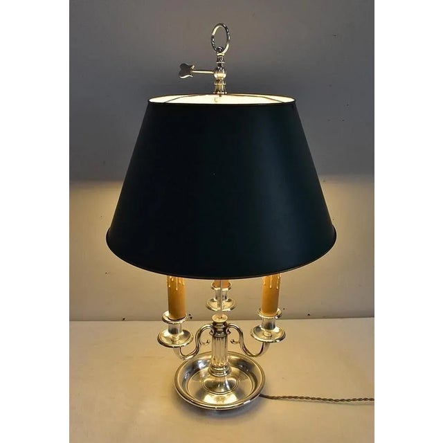 Lamp Bouillotte of Louis XVI style, topped with a lampshade in sheet metal, of conical shape and Empire Green color. This...