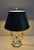 Lamp Bouillotte of Louis XVI style, topped with a lampshade in sheet metal, of conical shape and Empire Green color. This...