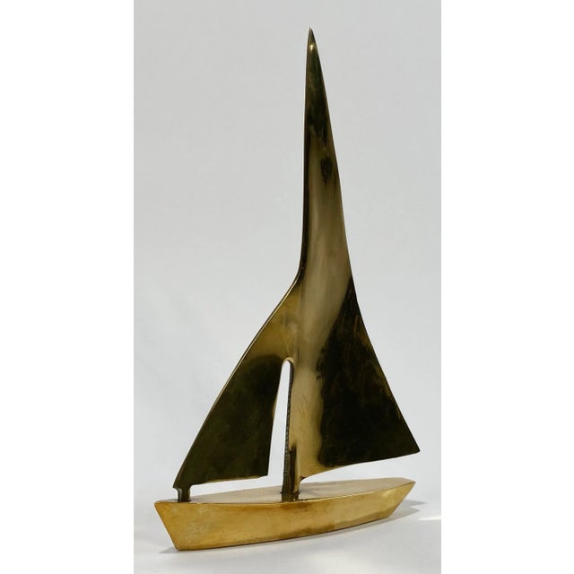 Large vintage mid century modern style sailboat figure featuring clean lines. Patina.