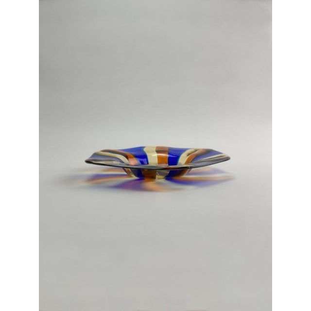 A Murano glass candy dish produced in Italy during the 1970s, crafted in a shallow, softly hexagonal form with a wide,...