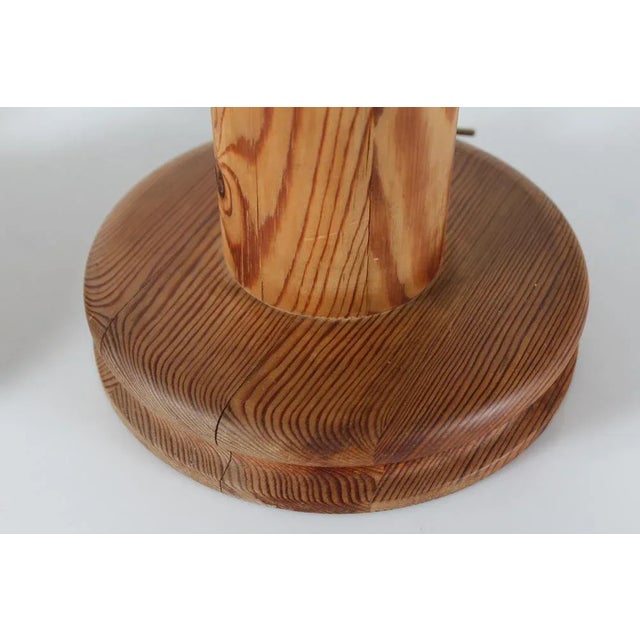 A pair of tall sculptural Uno Kristiansson table lamps made of solid turned pine, Sweden 1970s. Measures: Height incl....