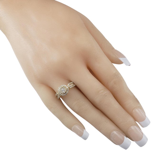 14 Karat Yellow Gold Diamond Cluster Ring Size 7 This sparkling ring features 55 round brilliant cut diamonds and 18...