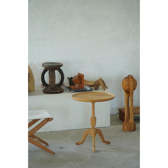 This refined side table is a classic example of Danish Mid-Century Modern design from the 1960s by Anton Kildeberg for...