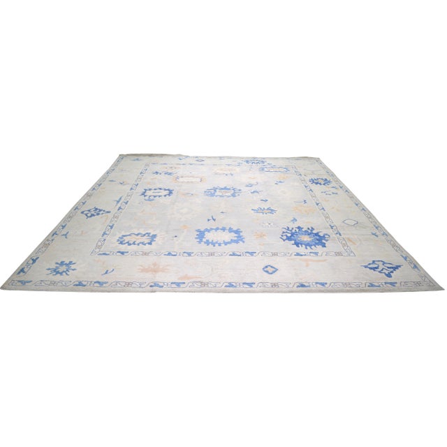 Hand-knotted with care using traditional rug-making techniques, this wool rug blends timeless craftsmanship with a modern...