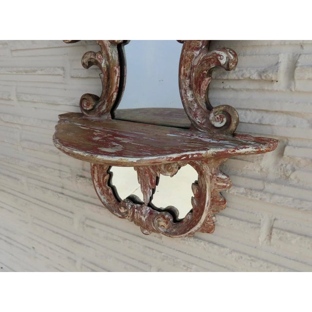 19th Century Italian carved wood and gilt mirror with shelf. Good condition