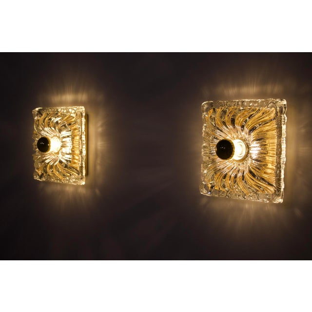 Pair of wall sconces in thick pressed glass, borrowing from the Shabby Chic style the romantic character of quilted...
