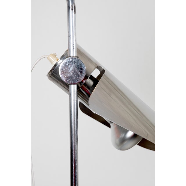 This unique desk lamp from the 1970s features a counterbalanced structure and a clever design that uses a paperclip to...