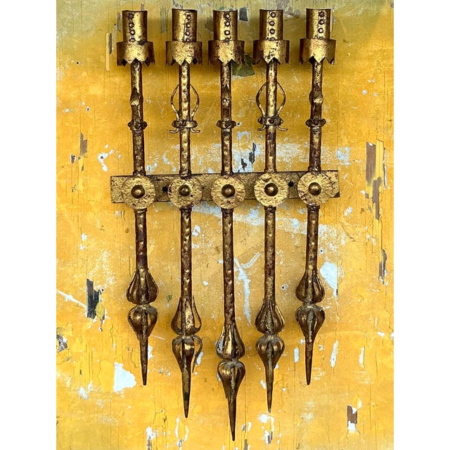 Make a bold statement with this Vintage Spanish Brutalist Five Arm Light Sconce. Featuring a rugged, sculptural design...