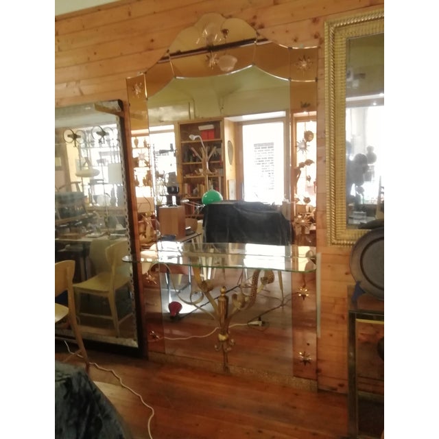 An impressive wall mirror with a built-in console/shelf. Original Italian design by Cristal Art Torino. Composed of a...
