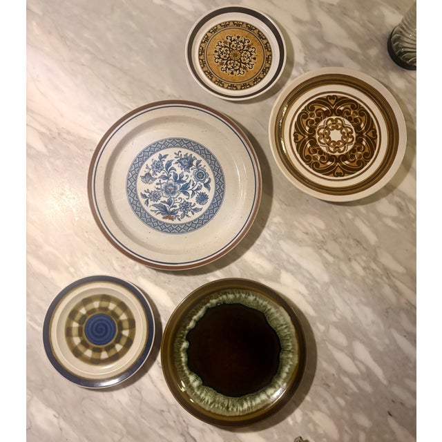 Elevate your gallery wall with this expertly curated, 5-piece collection of vintage 1970s stoneware and ironstone plates....