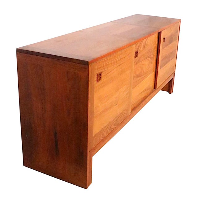 Classic Mid Century Danish Modern teak sideboard, credenza, server by E. Jacobsen Skive circa 1960's. The cabinet features...