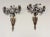 Great unusual pair of bronze and porcelain flower candle wall sconces in the form of flower filled urns. Note that the...