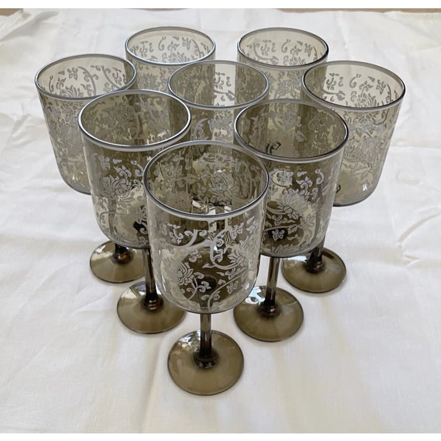 Beautiful set of 8 Smoked Color Wine Glasses w/Floral Etching. They almost have a green tint. Dark gray with white floral....
