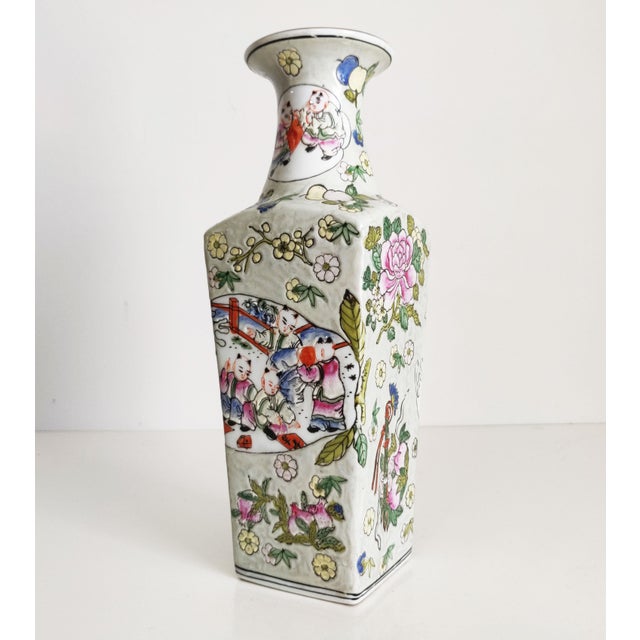 A colorful vase depicting a number of scenes. Training with swords is features in one scene, and on one side there is an...