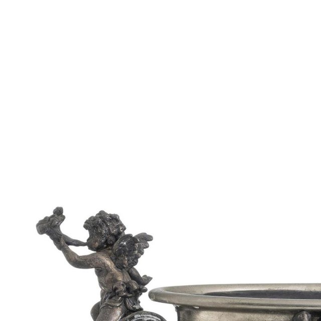 Decoration - Centerpiece - 19th Century. European, 19th-century silver-plated metal, decorated with angels, masks, and...