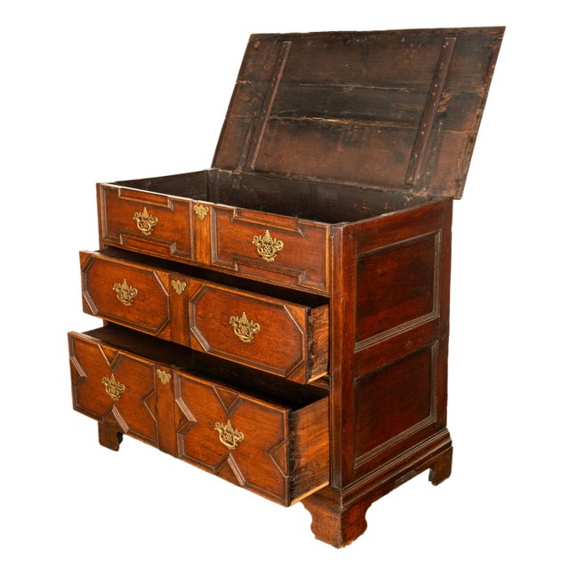 A good & unusual antique early 18th century William & Mary geometric oak chest with a lift up coffer top, circa 1700. The...