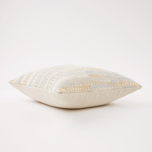 The Kay Pillow features a sophisticated jacquard weave, showcasing an abstract geometric patina. The understated neutral...