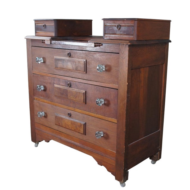 Circa 1880s Victorian dresser. Made from walnut with two glovebox drawers flanking a marble insert and three larger lower...
