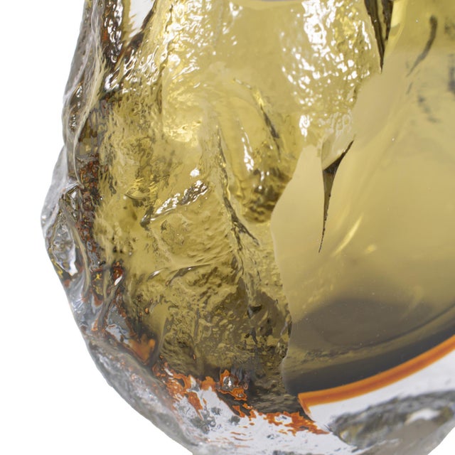 Featuring a sleek design and colorful tones, this piece stands out with its fluid, textured shape, making it a...