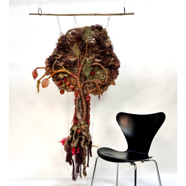 This striking apple tree-shaped macramé was handcrafted from dyed coconut fibers. It was created in West-Germany by an...