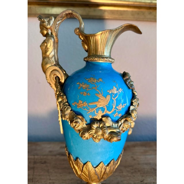 A matching pair of gorgeous antique French Sevres Style 19th century turquoise porcelain & gilded bronze Ormolu Putti bird...