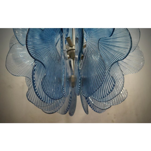 Splendid Murano glass chandelier with a particular shade of aqua blue color. Its round design is also very particular but...