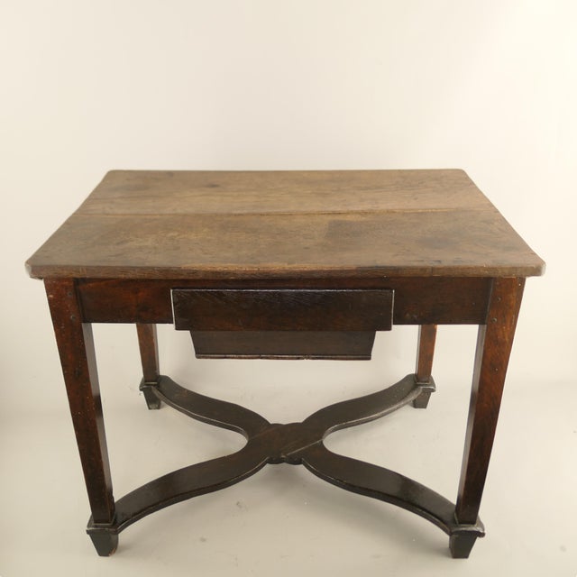 A traditional 19th-century South Tyrolean Alpine solid wood dining table, preserved in its original condition, carrying...