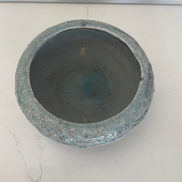 Beautiful vintage artisan pottery bowl. Has the artist signature on the bottom. Light blue with a crackle finish.