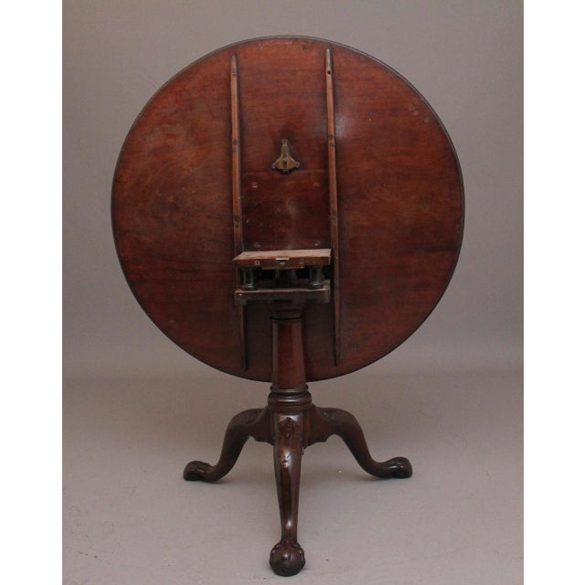 A large and impressive 18th Century mahogany tripod tea table, having a wonderful figured top that sits on a birdcage...