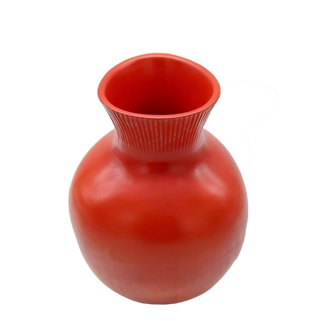 Beautiful and rare orange-coloured glazed ceramic vase with ribbed carvings, designed by Giovanni Gariboldi for the Ditta...