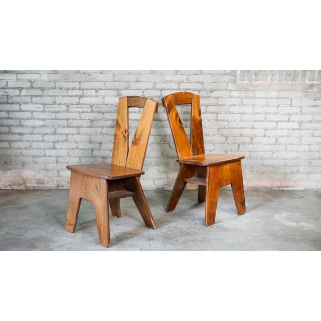 Pair architectural vernacular dining chairs from the 1970s European studio craft movement, styled in the manner of Pierre...