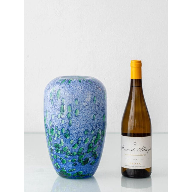 French mouth-blown art glass vase by La Rochère — blue and green cased glass, circa 1970s, the floating emerald inclusions...