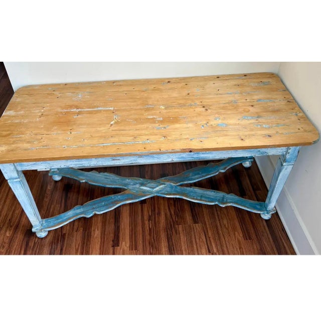 A charming antique Belgian farmhouse table featuring a beautifully weathered painted base in soft blue-gray tones and a...