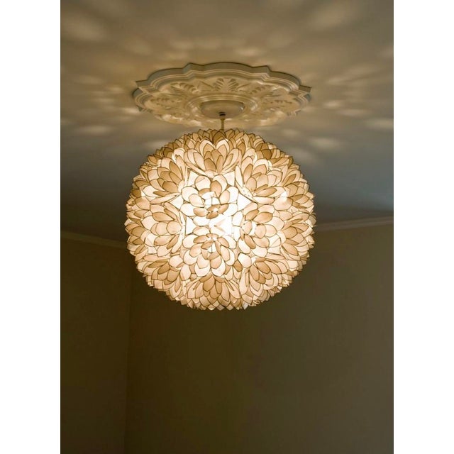 In good vintage condition. There is a shell that is broken on 2 petals, but once it’s up you can’t notice. Large. About...