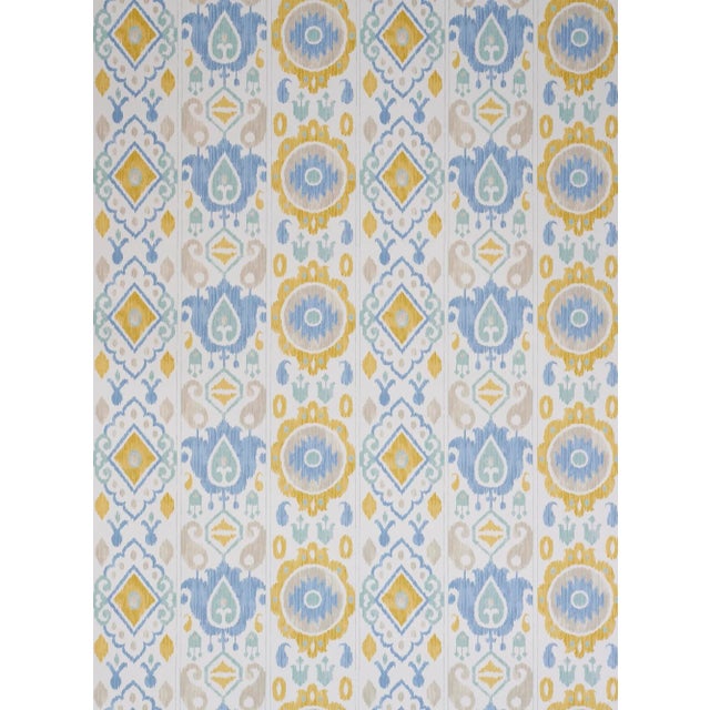 This delicate, muted striped wallcovering captures the look of a warp print ikat with watery colorations and an exotic...