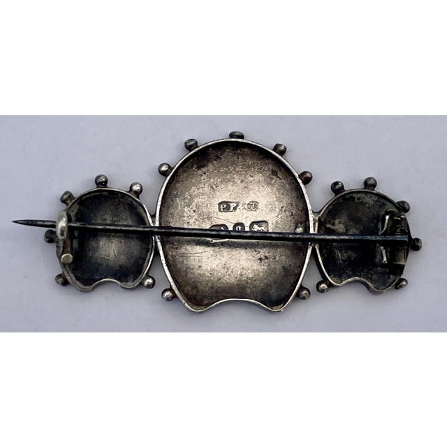 A charming good luck brooch by Payton, Pepper & Company with hallmarks on the back.