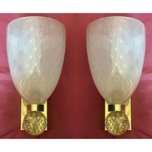 Gorgeous pair of sconces 24-karat gold by Barovier & Toso with gold inclusions. This piece is attributed to the mentioned...