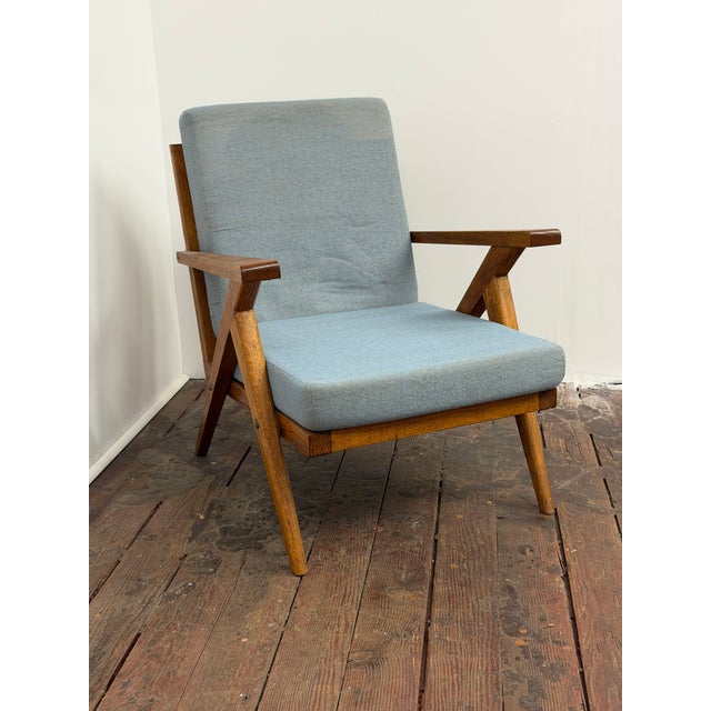 Mid-Century Modern oak slat Z style arm chair. The original Crawford tag is on the bottom of the seat cushion. The...