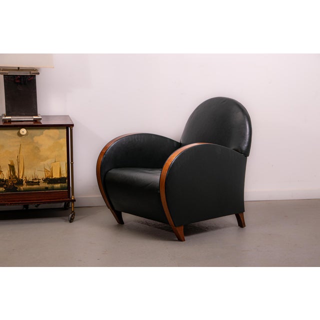 Pair of Mid- century armchairs made in Belgium in the 1970s. with an art deco inspired asthetic the chairs have British...